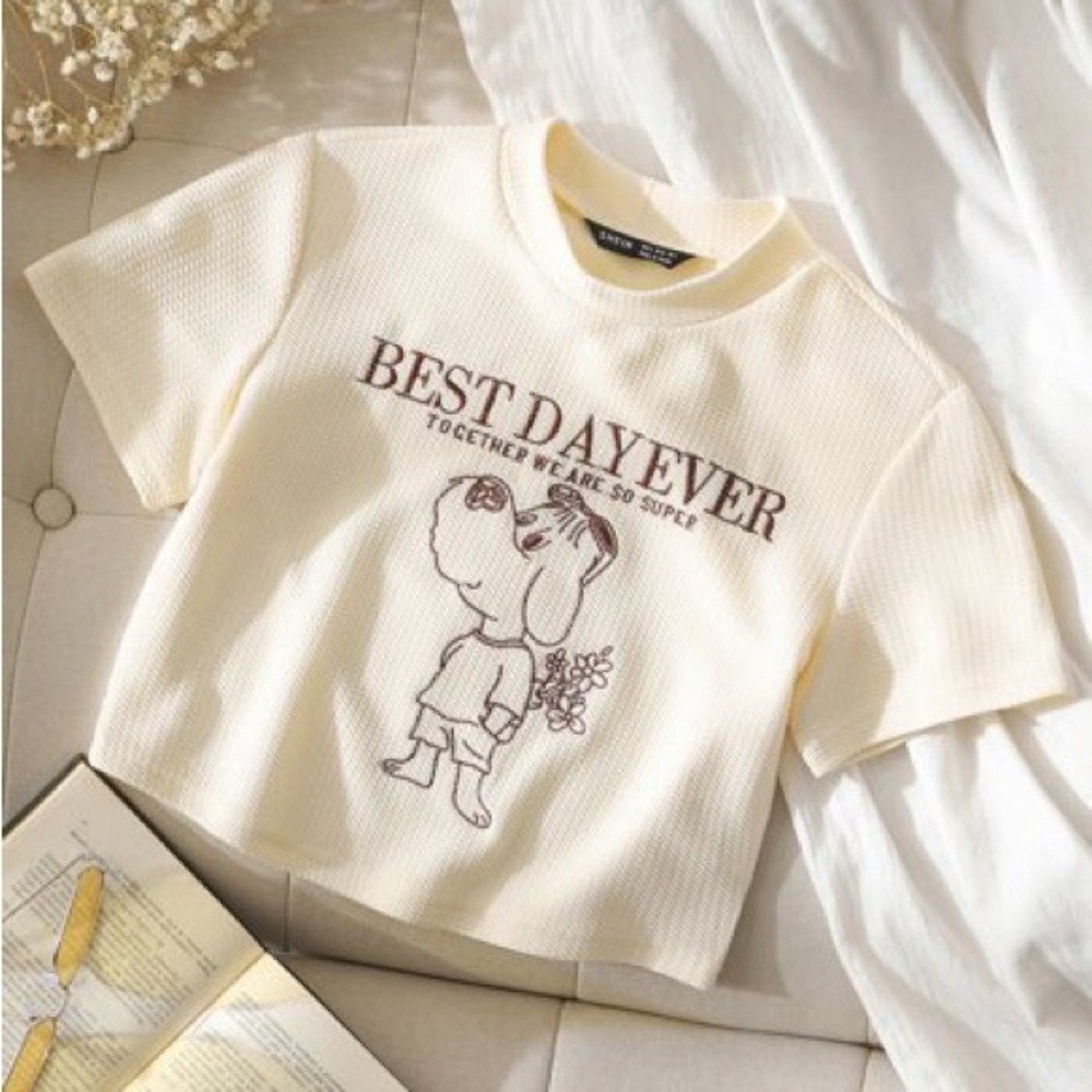 Large cream crop top with embroidered dog and happy saying